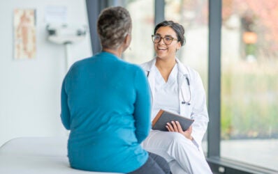 Medicare senior patient meeting with provider to discuss her health.