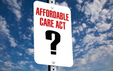 Affordable Care Act sign with question mark showing how government subsidies are unsure and likely to disappear