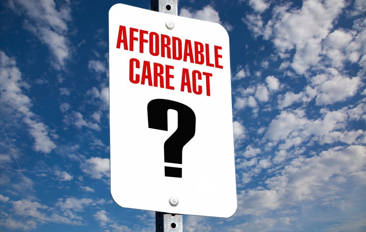 Affordable Care Act sign with question mark showing how government subsidies are unsure and likely to disappear